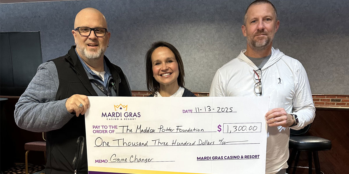 The Maddox Potter Foundation members holding a check at Mardi Gras Casino